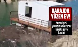 Barajda su seviyesi yükselince, konteyner baraka suya kapıldı