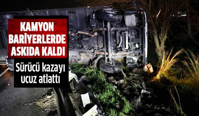 Kamyon bariyerlerde askıda kaldı!